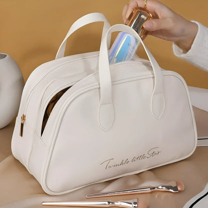 Leather travel toiletry bag with dry-wet separation compartments in caramel mocha colour with letter detailing