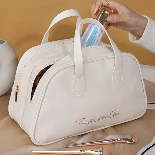 Leather travel toiletry bag with dry-wet separation compartments in caramel mocha colour with letter detailing