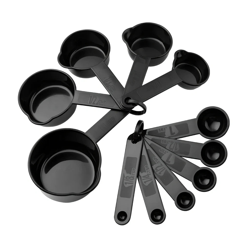 25-piece kitchen utensil set with hanging holes showing silicone heads and stainless steel handles organised on wall hooks