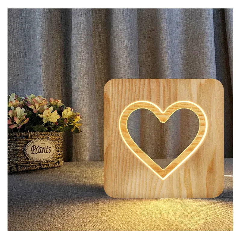 Solid wood hollow night lamp with warm white LED light on a surface