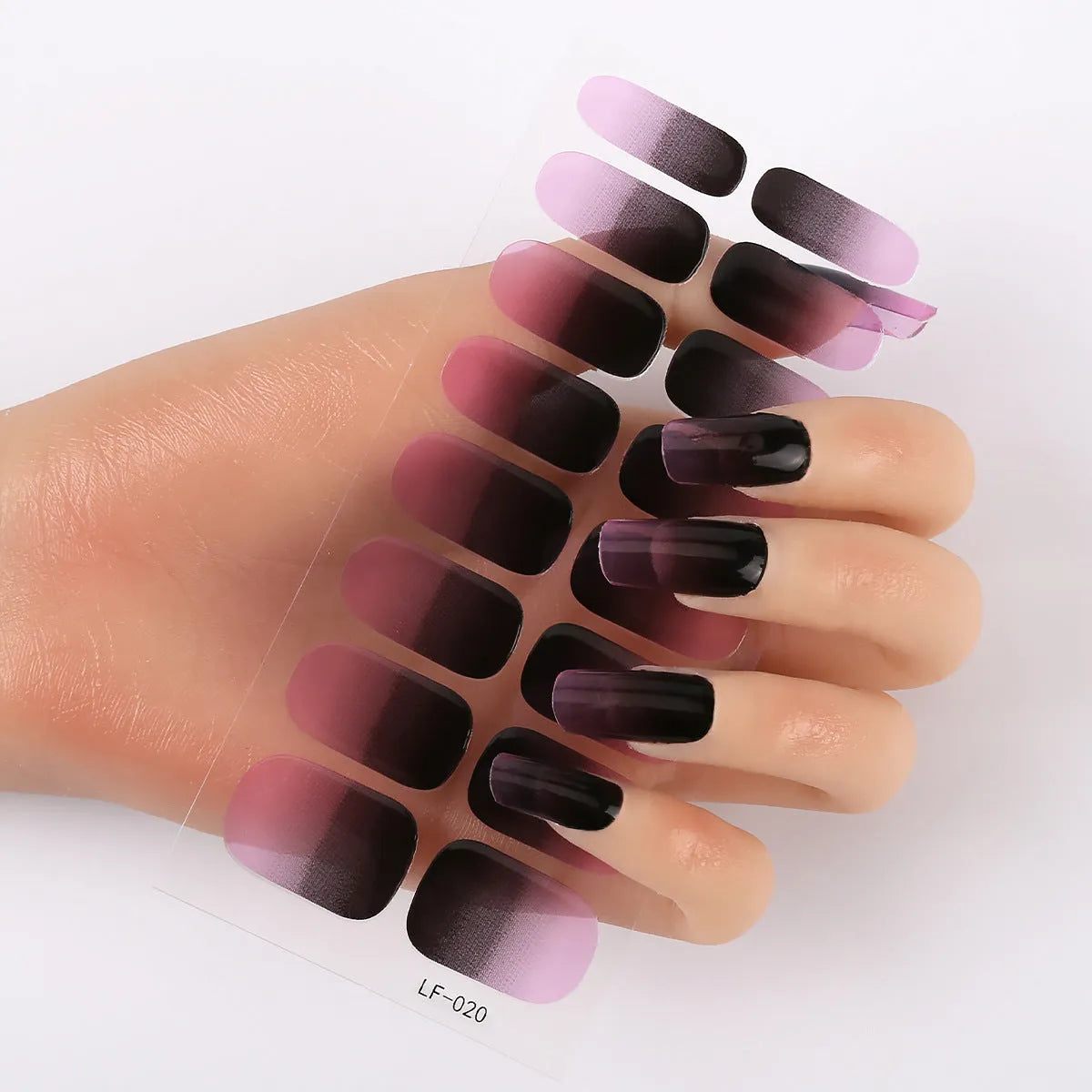 Sheet of 16 small design nail art stickers including cross, rose, tulip and marble patterns.