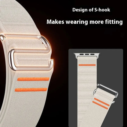 Elastic nylon Apple Watch band in Army Green with stainless steel buckle, shown on a wrist.