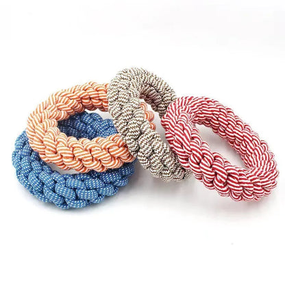 Cotton string braided ring knot dog chew toy showing woven texture and ring shape