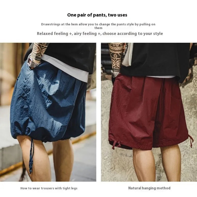 Men's Prussian blue embroidered loose-fit summer shorts on hanger