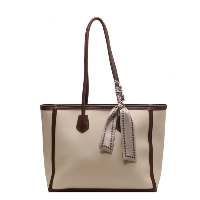 Soft PU shoulder tote bag in black with open outer pockets and internal organisation compartments