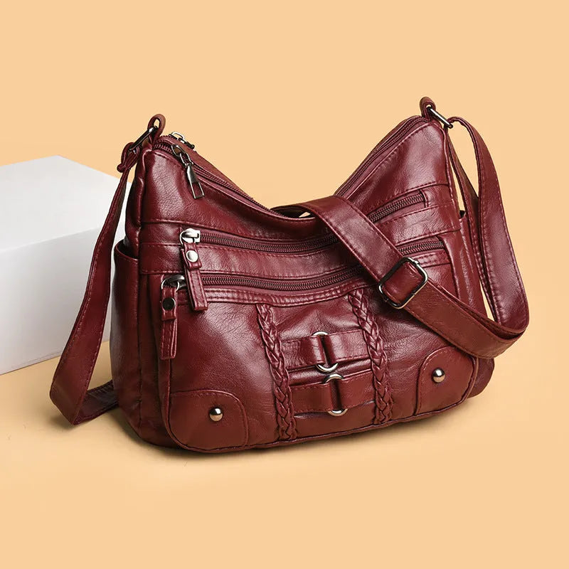 PU shoulder messenger bag with single strap, open outer pocket, and zip inner compartment in black, red, brown, or beige.
