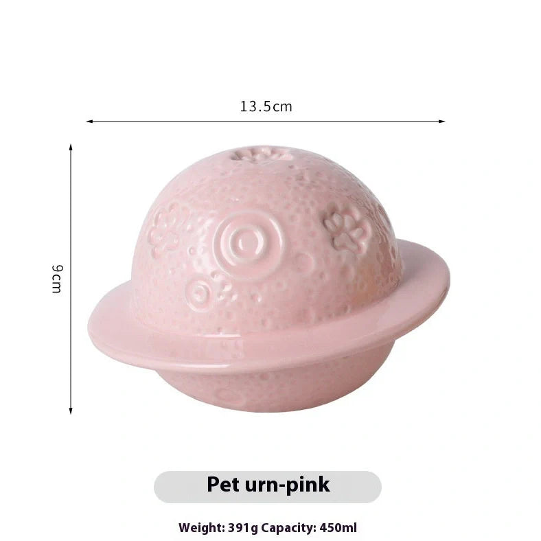 Handmade ceramic cinerary casket with cosmic starry sky design and cat-dog motifs in multiple colours