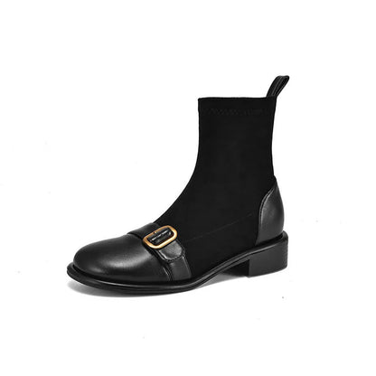 Women's black casual Martin boots with low heel, lace-up front, and decorative belt buckle stitching.