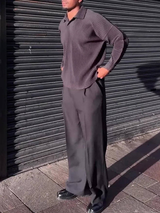 Man wearing a black pleated long-sleeve casual polyester top