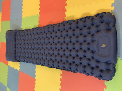 Portable inflatable camping cushion with built-in foot pump in various colors