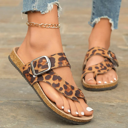 Leopard print Roman style slippers with a round toe and wooden sole.