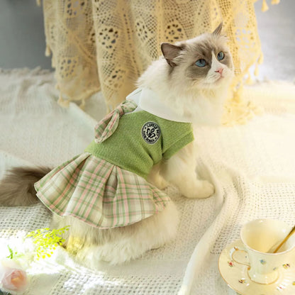 A pink, blue, or green tartan skirt for dogs and cats, shown in a princess style.
