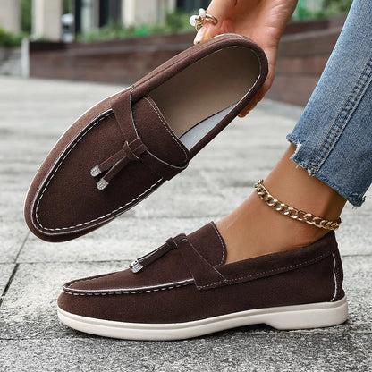 Solid colour canvas platform loafers with a rubber sole and round toe in apricot, shown from a side angle.