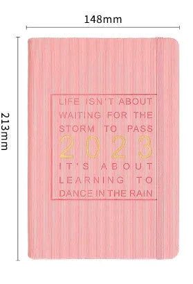 Creative student almanac diary with imitation leather cover open on a calendar page.