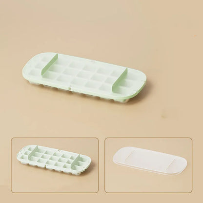 Yellow and blue food grade plastic ice cube trays with ice shovel stored in dedicated slot