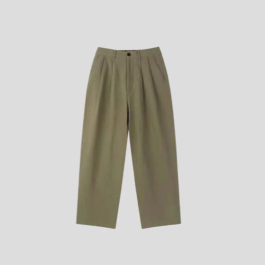 Men's apricot cotton linen trousers with elastic waistband and pencil leg opening on hanger
