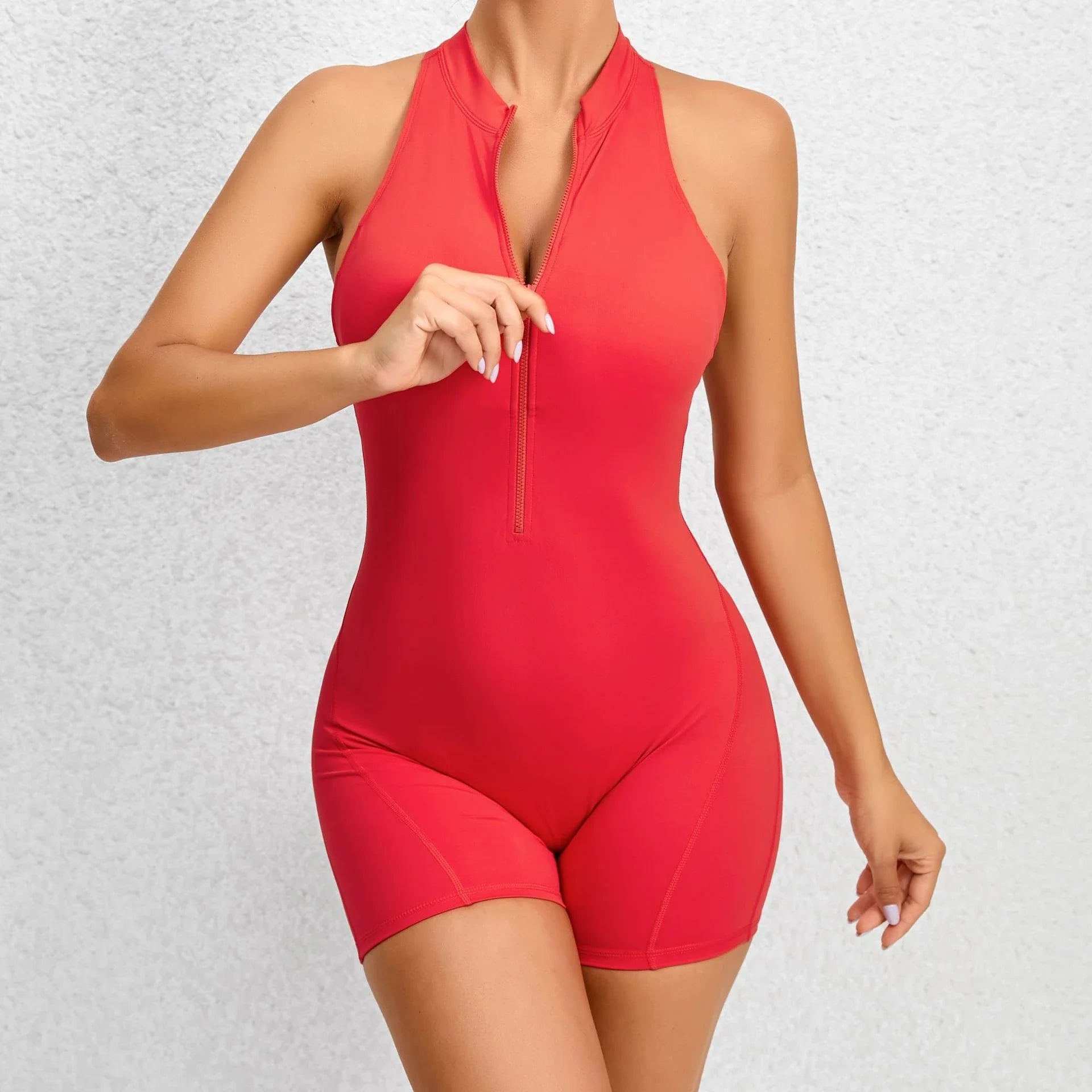 Women's sleeveless tummy control shapewear jumpsuit with zipper closure, available in multiple colors and sizes