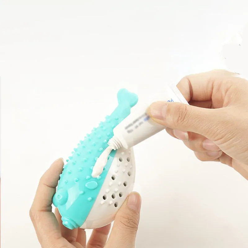 Small blue silicone fish-shaped chew toy for cats on a plain background.