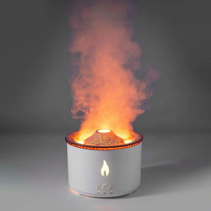 Black columnar ultrasonic humidifier producing jellyfish smoke rings with flame lighting effect