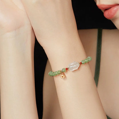 Handmade Hetian jade rabbit charm bracelet for women in glass or coloured glaze with a sweet rabbit design.
