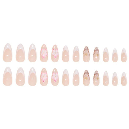 Set of floral French tip false nails with grey rock pattern accents on a simple pink base.