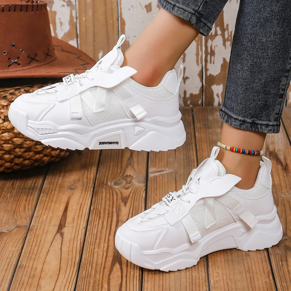 Women's platform sneakers in animal print with breathable mesh upper and front lace-up design.