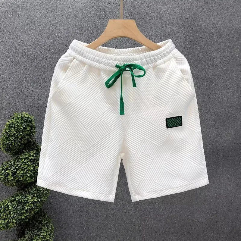 Men's casual sports shorts with micro-elastic polyester fabric suitable for beach, gym, and outdoor wear in solid black, green, or white available in eight sizes from M to 5XL with specific weight recommendations