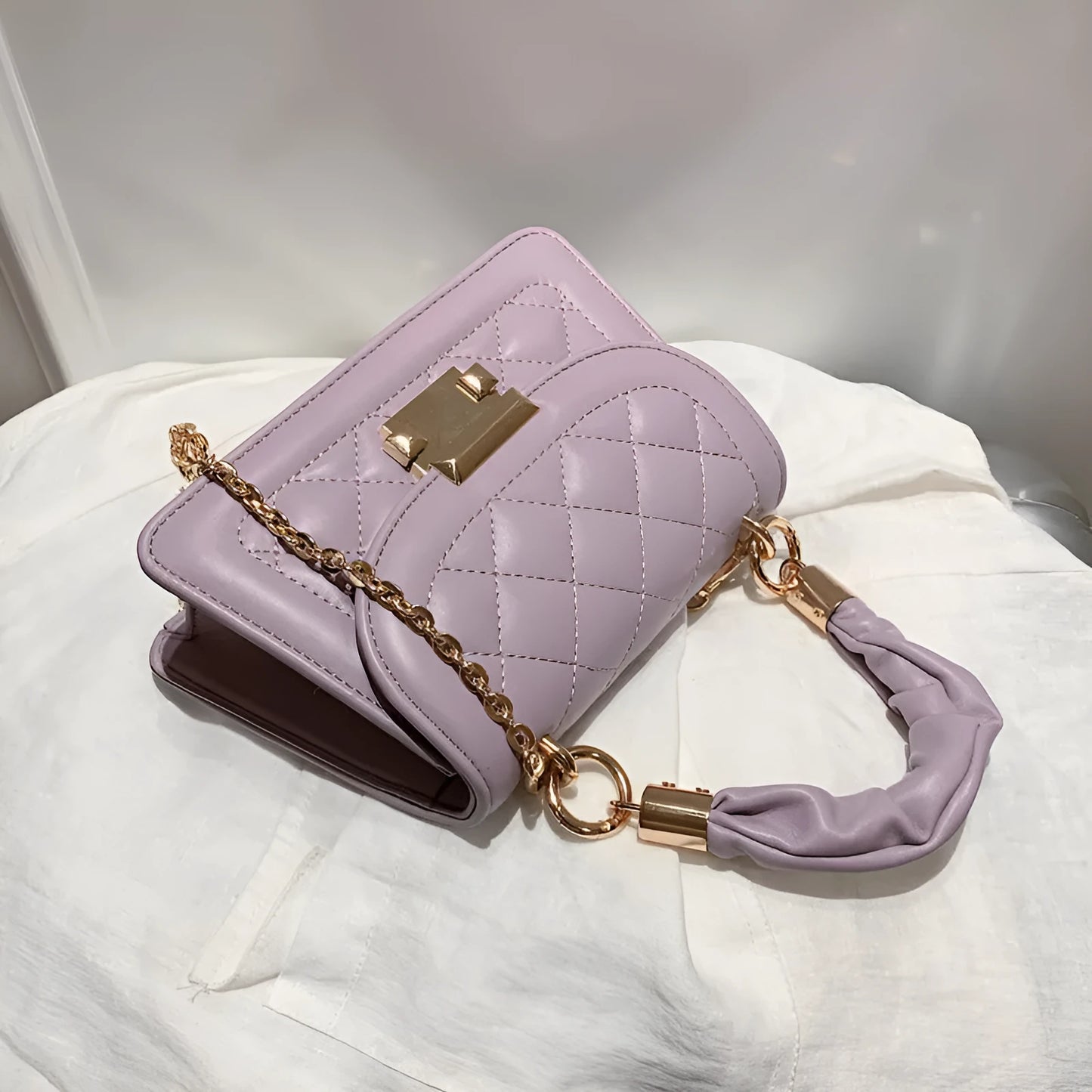 Beige rhombus-shaped women's crossbody bag with a long strap, showing front view and size.