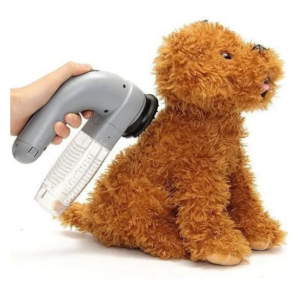 Grey portable pet hair vacuum cleaner with soft rubber head for grooming cats and dogs.
