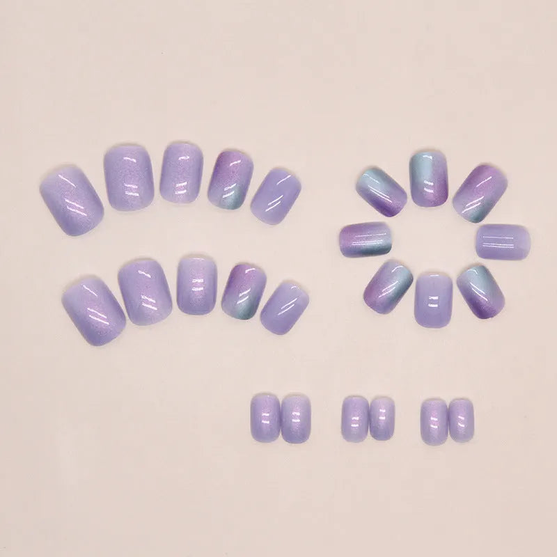 Short aurora fake nails with bright starry sky glitter pattern, 24-piece set with adhesive glue