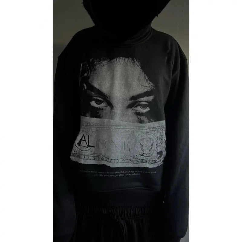Black women's hoodie with cartoon print design in loose fit polyester construction