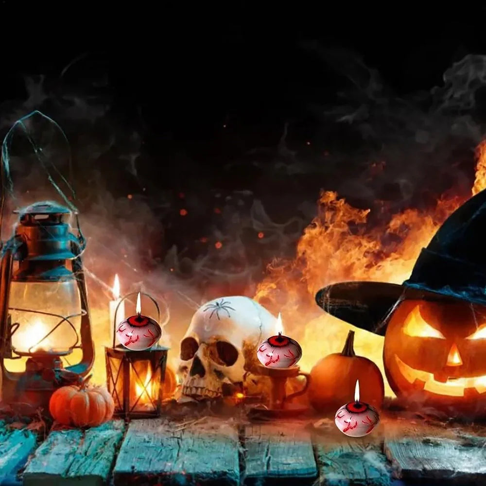 Red oval paraffin floating candle resembling eyeball in Halloween water display