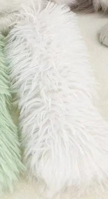 Plush cat toy pillow in blue, green, pink, and white colours measuring 27 by 10 centimetres