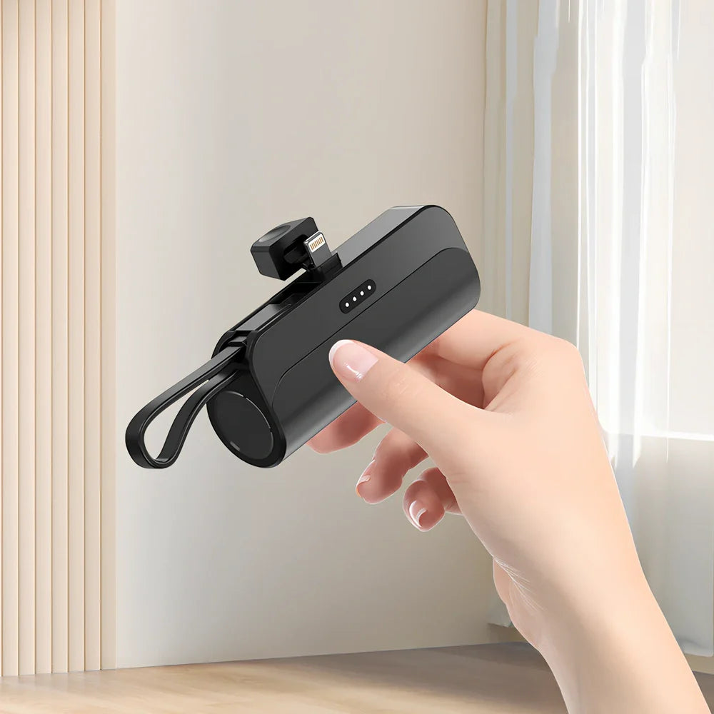 White capsule power bank showing compact 79mm size with USB charging ports visible