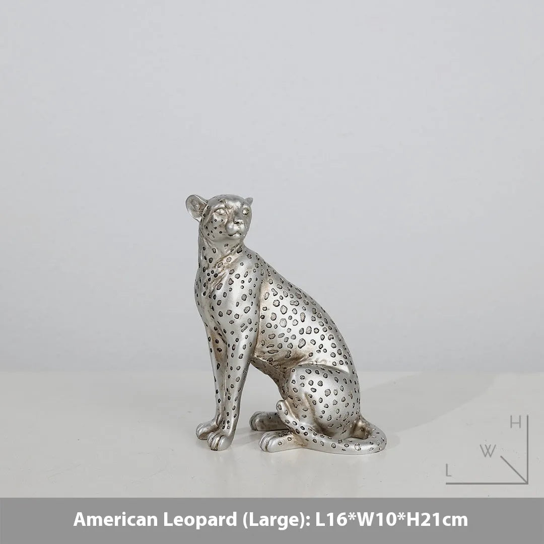 Leopard resin home ornament in American Leopard colour showing three pose variations on wooden surface