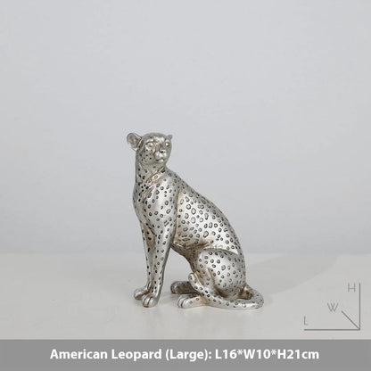Leopard resin home ornament in American Leopard colour showing three pose variations on wooden surface