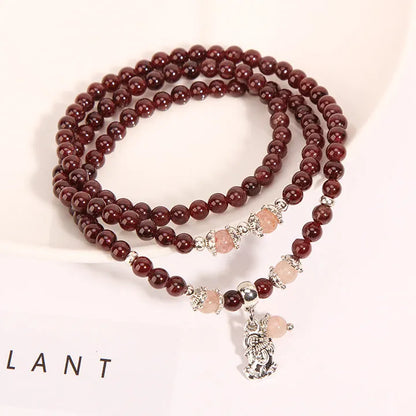 Wine red garnet crystal floral bracelet with Bohemian and ethnic design elements