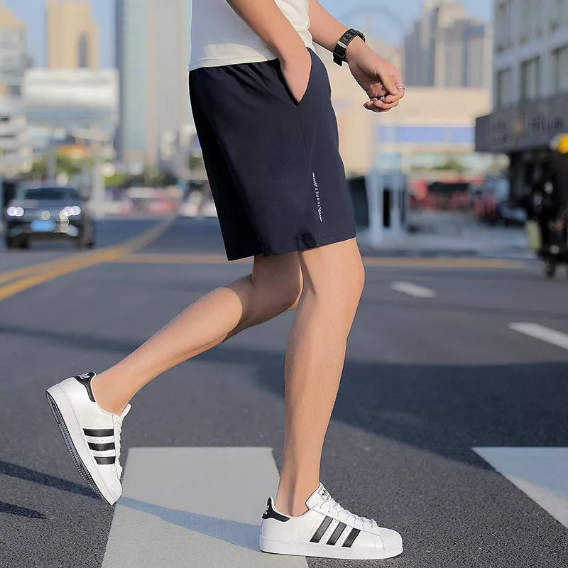 Men's Five-point Sports Shorts in quick-drying cotton, available in gray, black, and blue