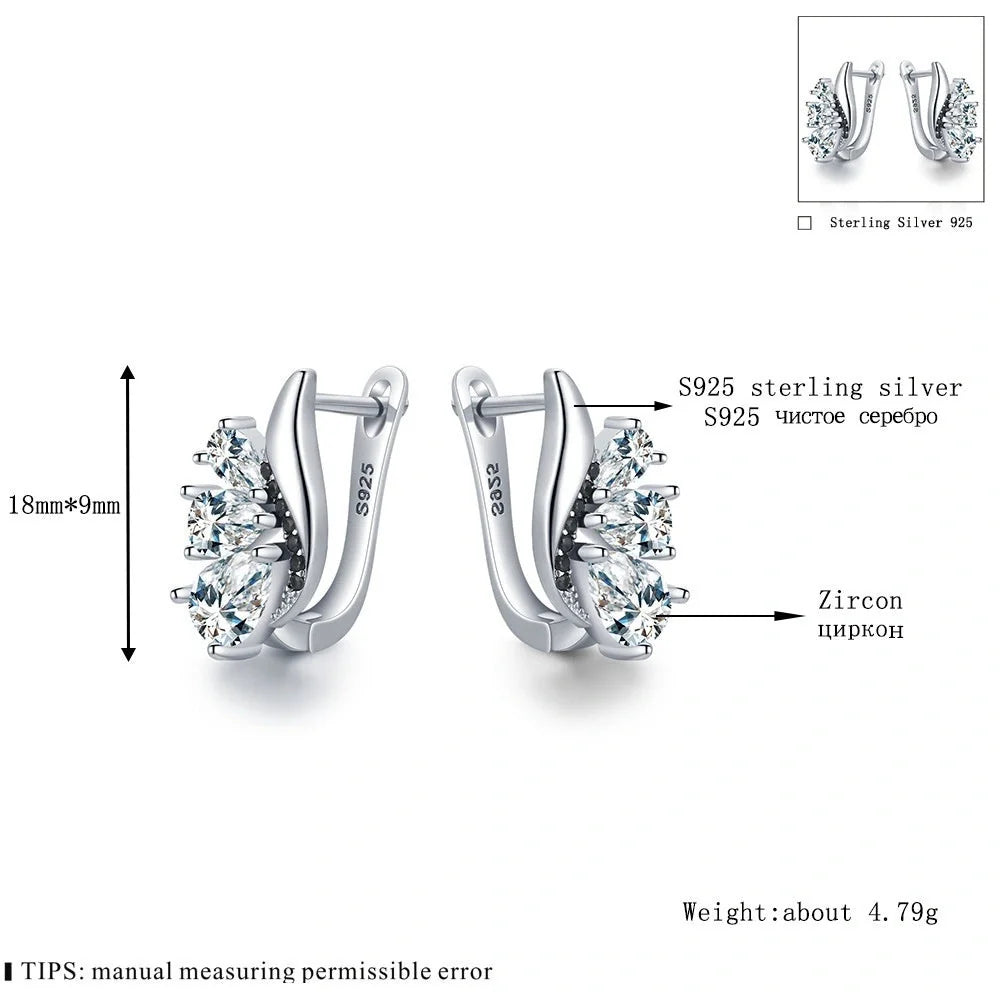 Elegant wing-shaped earrings with drop-shaped zircon stones, crafted with copper for a sophisticated and fashionable look