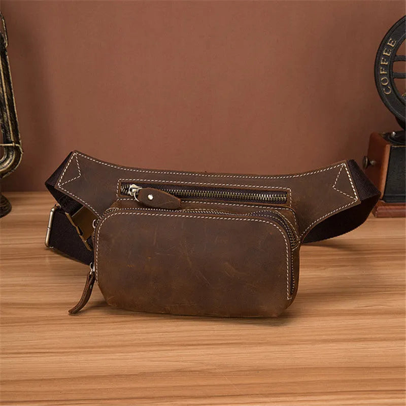 Brown top layer cowhide men's sports waist bag showing 30 cm width, pull closure, and internal phone compartment