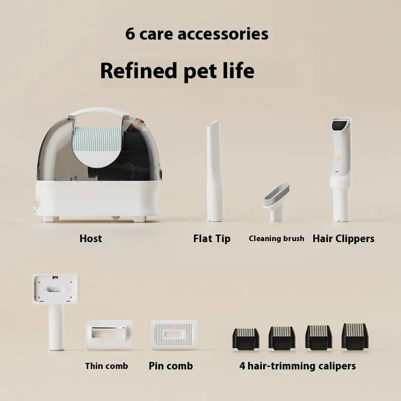 Pink and white pet grooming vacuum cleaner with shear attachment and accessories on a white background.