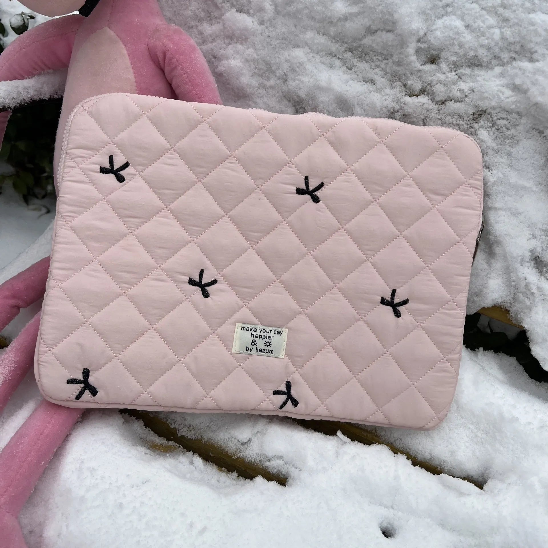 Nylon notebook storage bag with rhombus embroidery and bow, shown in light blue colour.