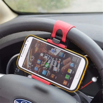 Black steering wheel phone holder with 75mm clip mounted on car wheel holding smartphone
