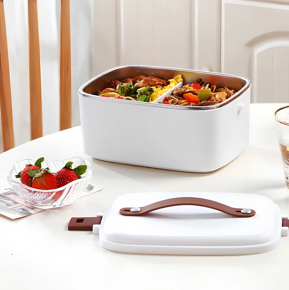 White car heating lunch box with stainless steel interior showing power cords and utensils