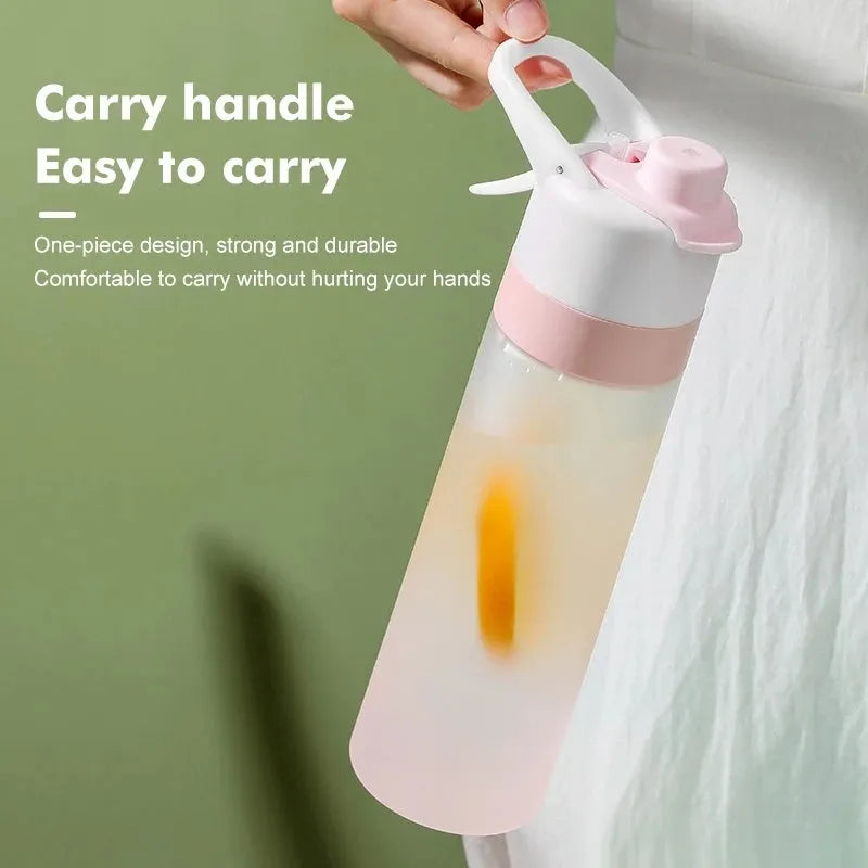 Large plastic spray water bottle with handle strap and leakproof lid in green colour.