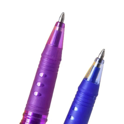 A set of hot erasable gel pens in multiple colours with plastic bodies and stainless steel nibs, shown with a hairdryer to illustrate the heat-erasable function.
