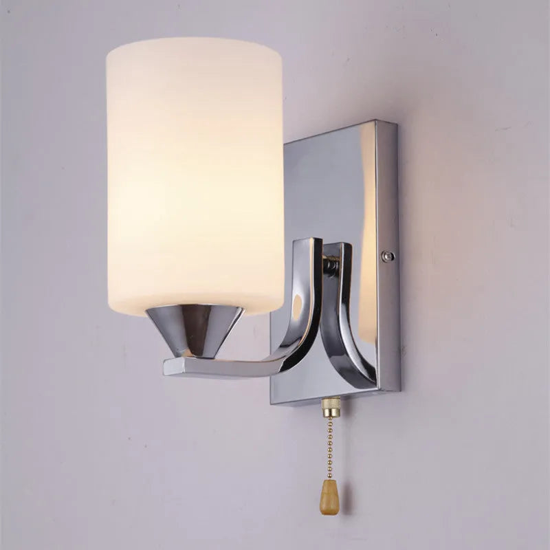Minimalist chrome glass wall lamp with adjustable light colours for bedside illumination