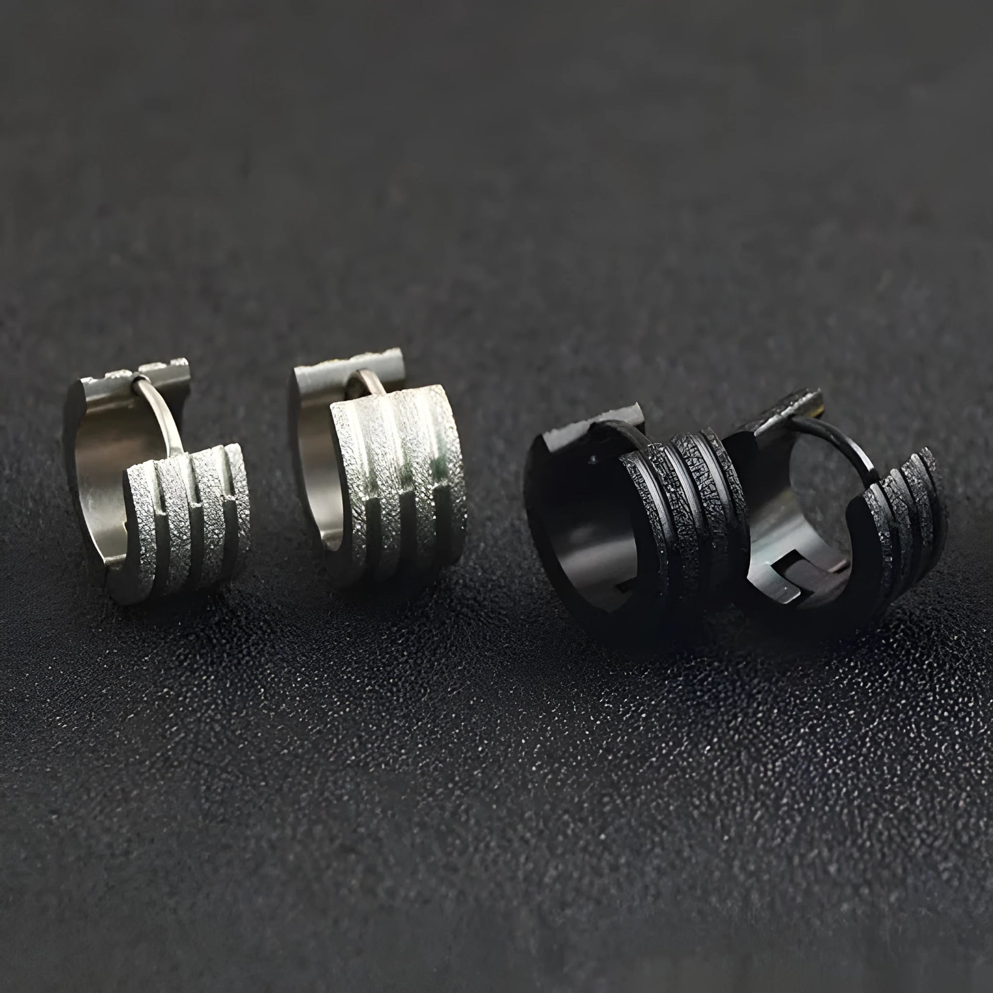 Geometric titanium steel earrings with frosted three-line design in black, gold, and steel colour finishes
