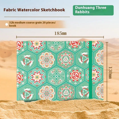 Feiluniao watercolour notebook with fabric cover, 185mm length, open to show paper for painting.