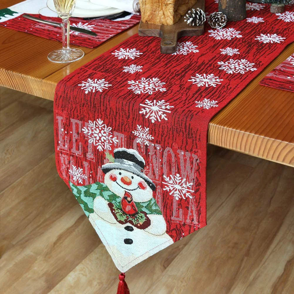 Red Christmas tablecloth with snowman and snowflake designs for festive holiday decor